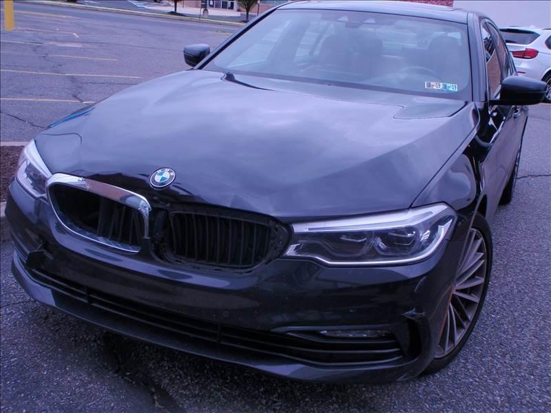 BMW with dents in the hood